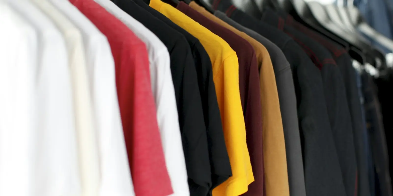 Clothes on a rail ready for sizing and fitting